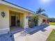 Inviting front porch with decorative details, including a classic wooden door and stone accents at 1599 Mcauliffe Ln, Palm Harbor, FL 34683
