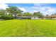 Expansive backyard with a screened patio area, perfect for outdoor entertaining and relaxation at 1675 Robin Hood Ln, Clearwater, FL 33764