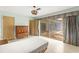 Bedroom with sliding glass doors leading to lanai at 1675 Robin Hood Ln, Clearwater, FL 33764