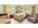 Bedroom featuring a retro design with unique furnishings and natural lighting at 1675 Robin Hood Ln, Clearwater, FL 33764