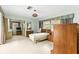 Large bedroom with terrazzo floor and retro fixtures and furniture at 1675 Robin Hood Ln, Clearwater, FL 33764