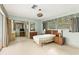 Large bedroom with adjacent desk and furniture at 1675 Robin Hood Ln, Clearwater, FL 33764