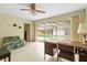Inviting living room with pool views through sliding glass doors to the covered patio at 1675 Robin Hood Ln, Clearwater, FL 33764