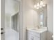 Bathroom featuring a modern vanity, stylish fixtures, and door leading to a walk-in shower at 174 Hidden Estates Ct, Brandon, FL 33511