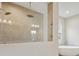 Luxurious bathroom featuring a glass enclosed shower and separate soaking tub at 174 Hidden Estates Ct, Brandon, FL 33511