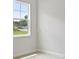 Brightly lit bedroom features a large window at 174 Hidden Estates Ct, Brandon, FL 33511