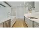 A well-appointed kitchen featuring granite counters, a stainless steel dishwasher, and modern appliances at 174 Hidden Estates Ct, Brandon, FL 33511