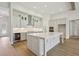 Modern kitchen with a large center island, stainless appliances, and lots of white cabinet space at 174 Hidden Estates Ct, Brandon, FL 33511