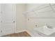 Practical laundry room with sink, storage shelf and room for appliances offers convenience at 174 Hidden Estates Ct, Brandon, FL 33511