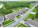 Overhead shot of neighborhood homes surrounded by a pond and greenery at 17845 Cortes Creek Blvd, Spring Hill, FL 34610