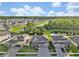 Aerial view showcasing the community, homes, and water features at 17845 Cortes Creek Blvd, Spring Hill, FL 34610