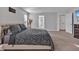 Comfortable bedroom features soft carpet, neutral paint, and is accentuated by the natural light from an adjacent window at 17845 Cortes Creek Blvd, Spring Hill, FL 34610