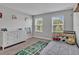 Charming bedroom with fun decor, carpet floors, and a bright window view at 17845 Cortes Creek Blvd, Spring Hill, FL 34610
