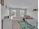 Cozy bedroom with natural light, play rug, and comfortable bed at 17845 Cortes Creek Blvd, Spring Hill, FL 34610