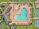 Beautiful community pool with lounge chairs, umbrellas, and surrounding green spaces at 17845 Cortes Creek Blvd, Spring Hill, FL 34610