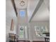 Bright foyer with a two-story ceiling, shiplap wall and decorative chandelier at 17845 Cortes Creek Blvd, Spring Hill, FL 34610