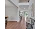 Elegant foyer with wood-look flooring, shiplap accent wall and natural light at 17845 Cortes Creek Blvd, Spring Hill, FL 34610