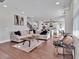 Spacious living room showcases seamless flow with a modern kitchen and adjacent dining area at 17845 Cortes Creek Blvd, Spring Hill, FL 34610