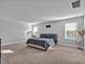 Spacious main bedroom with carpet floors, a window view, and a relaxing atmosphere at 17845 Cortes Creek Blvd, Spring Hill, FL 34610