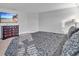 Comfortable main bedroom featuring a large TV and a dark wood dresser at 17845 Cortes Creek Blvd, Spring Hill, FL 34610