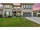 Stunning two-story home with three-car garage, manicured lawn, blue shutters and a balcony at 17914 Bramshot Pl, Lutz, FL 33559