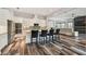 The modern kitchen features stainless steel appliances, a breakfast bar, and white cabinets at 17914 Bramshot Pl, Lutz, FL 33559