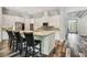 Bright, updated kitchen with an island, stainless steel appliances and modern backsplash at 17914 Bramshot Pl, Lutz, FL 33559