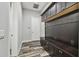 Mud room featuring built-in bench seating, coat hooks and storage at 17914 Bramshot Pl, Lutz, FL 33559