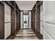 The walk-in closet features shelving, custom wooden storage solutions, and wood laminate floors at 17914 Bramshot Pl, Lutz, FL 33559