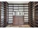 This expansive walk-in closet features ample shelving, drawers, and custom storage solutions at 17914 Bramshot Pl, Lutz, FL 33559