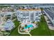 Waterfront condo complex featuring a pool, well-maintained grounds, and bay views at 17980 Gulf Blvd # 505, Redington Shores, FL 33708
