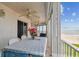 Oceanfront balcony with dining table and ocean view, perfect for enjoying coastal living at 17980 Gulf Blvd # 505, Redington Shores, FL 33708