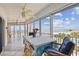 Relax on this balcony overlooking the beach with tile floors, ceiling fan and balcony furniture at 17980 Gulf Blvd # 505, Redington Shores, FL 33708