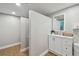 The restroom area features a clean vanity with a mirror and private stalls at 17980 Gulf Blvd # 505, Redington Shores, FL 33708