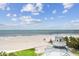 Expansive beach view showcasing the shoreline and clear, blue skies at 17980 Gulf Blvd # 505, Redington Shores, FL 33708