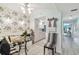 Eat-in dining area with booth seating, glass table, and palm wallpaper at 17980 Gulf Blvd # 505, Redington Shores, FL 33708