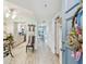 Inviting entryway that features wood-look tile floors, coat closet and a view of the kitchen at 17980 Gulf Blvd # 505, Redington Shores, FL 33708