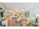 Spacious living room featuring comfortable seating, stylish decor and a peek into the kitchen at 17980 Gulf Blvd # 505, Redington Shores, FL 33708