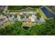 Panoramic aerial view showcasing homes, landscaping, and a serene pond at 19247 Otters Wick Way, Land O Lakes, FL 34638