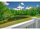 The backyard view reveals a serene pond surrounded by lush greenery, creating a private and tranquil outdoor retreat at 19247 Otters Wick Way, Land O Lakes, FL 34638