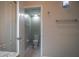 Neutral bathroom with a tile floor, a toilet, and towel bars at 19247 Otters Wick Way, Land O Lakes, FL 34638