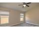 Vaulted ceiling bedroom featuring plush carpets, natural light, and a ceiling fan at 19247 Otters Wick Way, Land O Lakes, FL 34638