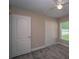 Bedroom featuring carpet, a window, a ceiling fan, and a closet at 19247 Otters Wick Way, Land O Lakes, FL 34638
