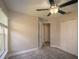 Inviting bedroom with ceiling fan, natural light, and closet space at 19247 Otters Wick Way, Land O Lakes, FL 34638
