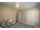 Bedroom featuring carpet, a ceiling fan, a closet, and neutral paint at 19247 Otters Wick Way, Land O Lakes, FL 34638