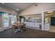Clubhouse kitchen features white cabinets, a dining table and easy access to the pool, creating a great gathering spot at 19247 Otters Wick Way, Land O Lakes, FL 34638
