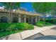 Exterior view of the community clubhouse with well-maintained landscaping, providing a welcoming space for residents to gather and socialize at 19247 Otters Wick Way, Land O Lakes, FL 34638