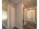 Hallway with carpet, doors, and an archway at 19247 Otters Wick Way, Land O Lakes, FL 34638
