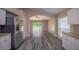 A view of the open floor plan looking from the kitchen to living room and backyard at 19247 Otters Wick Way, Land O Lakes, FL 34638