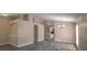 Spacious living room featuring modern flooring, neutral walls, and an elegant chandelier at 19247 Otters Wick Way, Land O Lakes, FL 34638